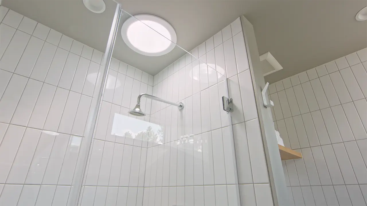 Frame Hotel SoCo — skylit spa bathroom
