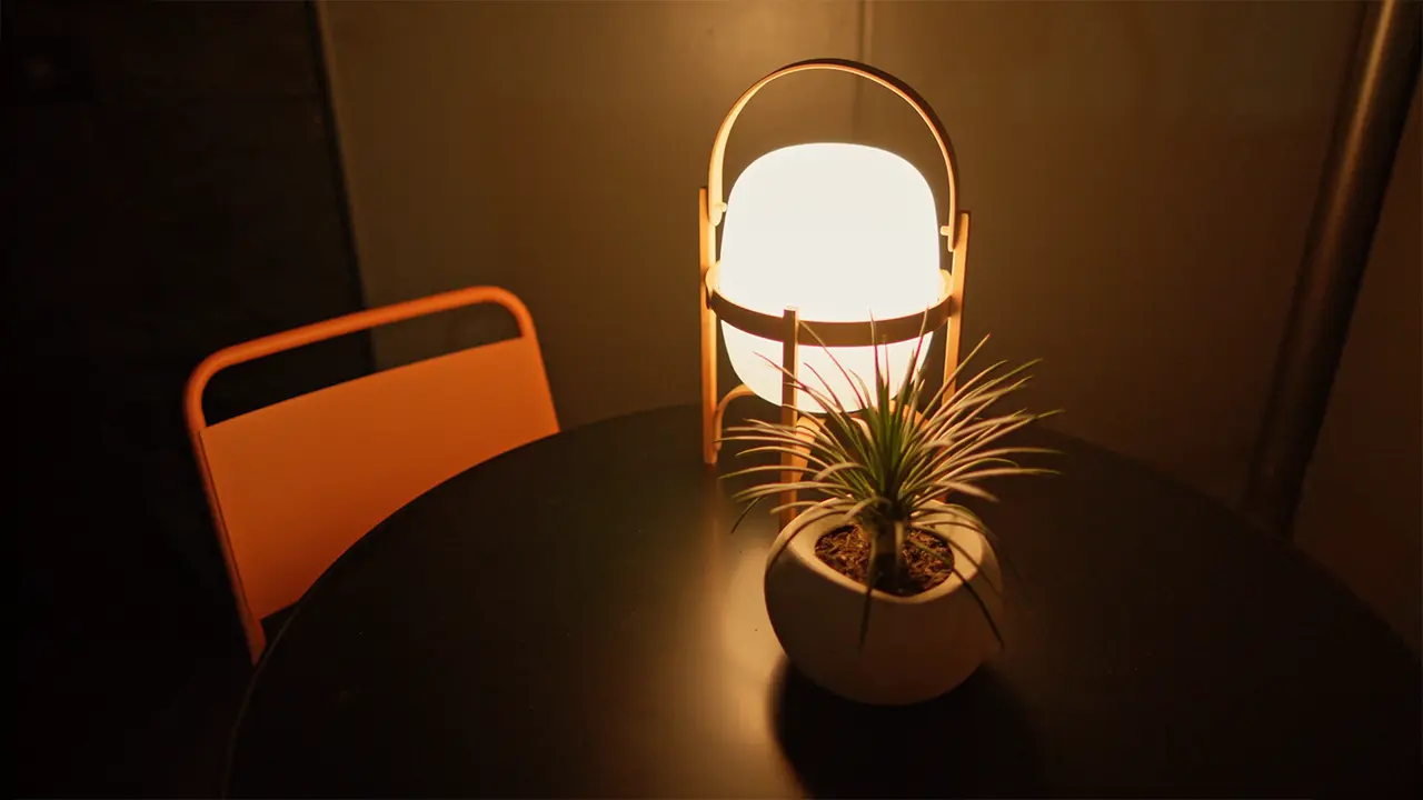 Frame Hotel SoCo — lanai dining table at night