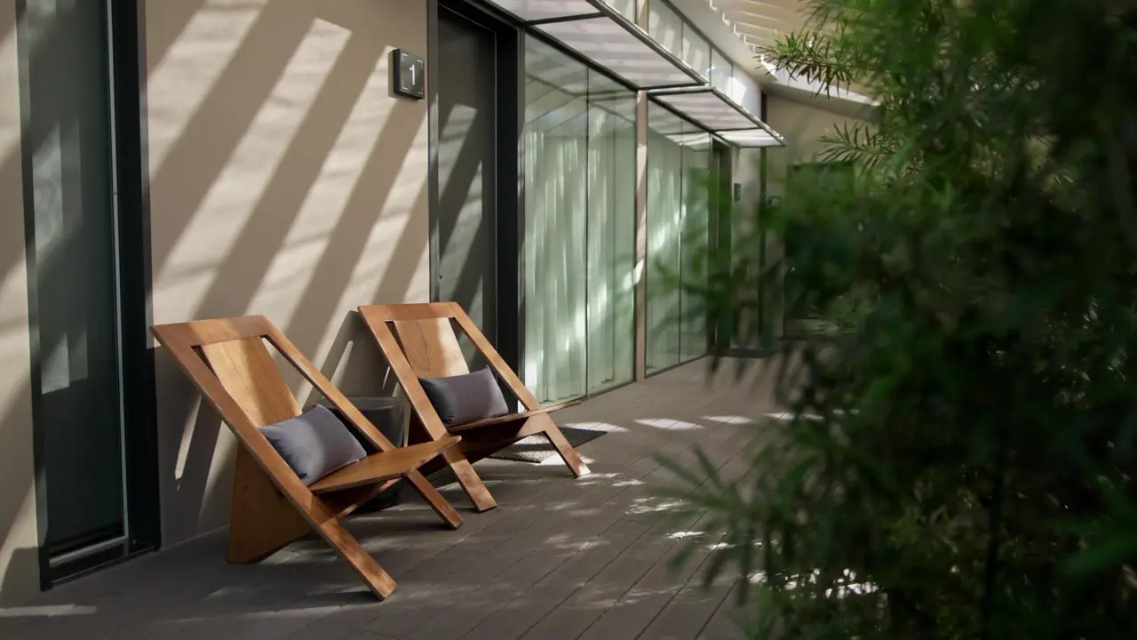 Frame Hotel Treehouse — Common Room with egg chairs